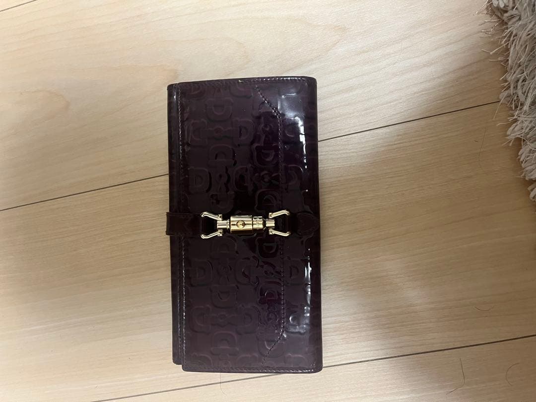 Gucciダークパープル エンボスロゴ 長財布